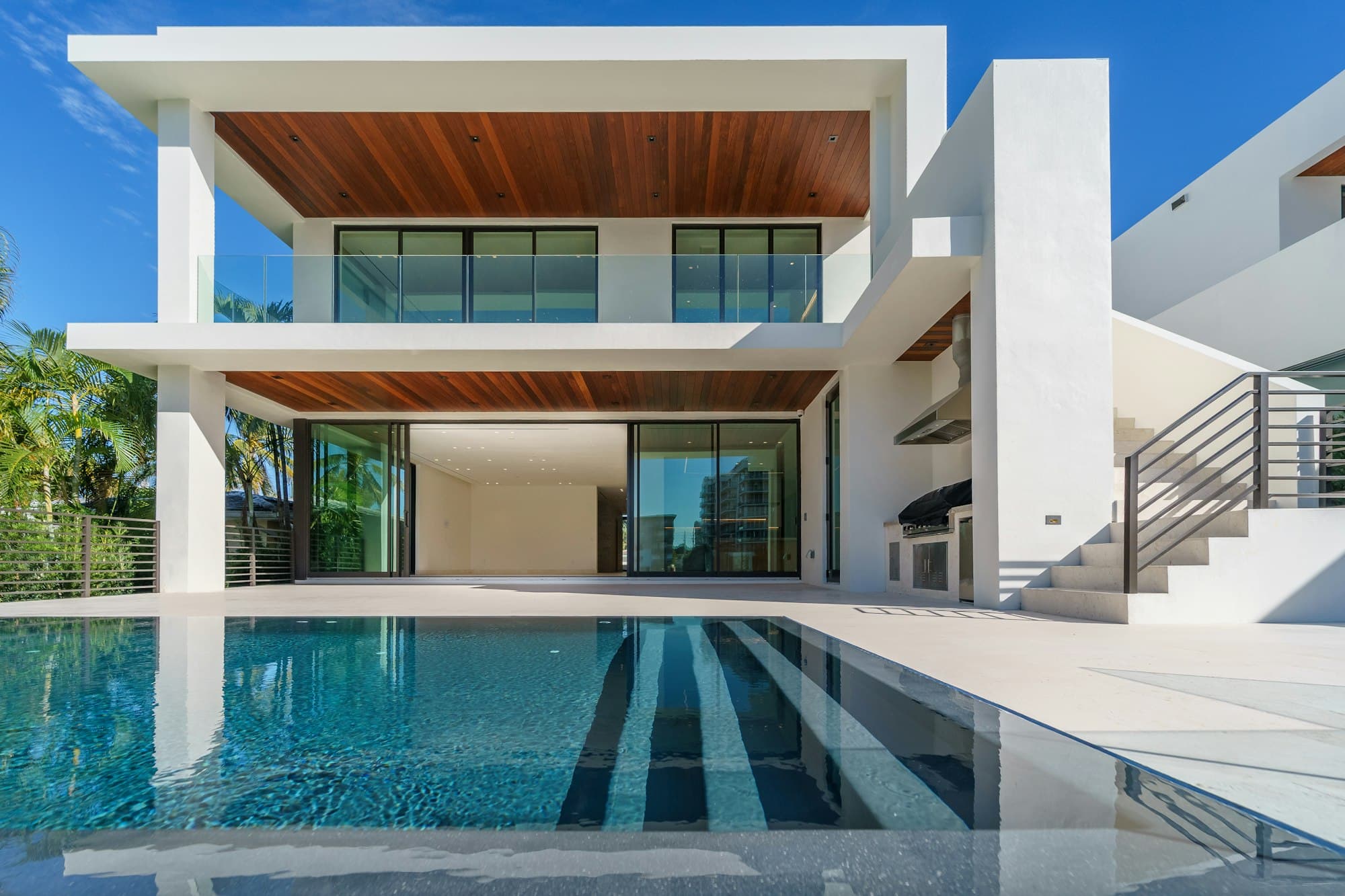 A modern residence with a still pool